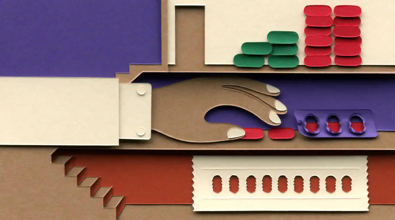 Main en papier découpé près de gélules, illustration d'un article sur le safran et la dépression